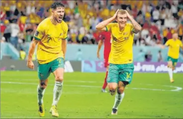  ?? REUTERS ?? Australia's Mathew Leckie (L) celebrates after scoring the winner against Denmark at the Al Janoub Stadium on Wednesday.