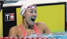  ?? LEE JIN-MAN THE ASSOCIATED PRESS ?? China's Liu Xiang celebrates after winning the women's 50-metre backstroke final during the swimming competitio­n at the 18th Asian Games in Jakarta, Indonesia on Tuesday.