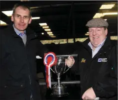  ??  ?? Cathal Whittle, Donard, receives the cup from Tom Coleman.