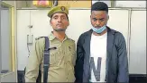  ?? ?? The suspect in police custody on Friday.
SUNIL GHOSH/ HT