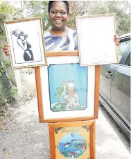  ?? PHOTO BY CECELIA CAMPBELL-LIVINGSTON ?? Jacqueline Scott displaying some of the artwork done by ex-convict Whyette Gordon.