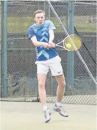  ??  ?? Champion Camerong Lang powers down a backhand during his men’s singles victory