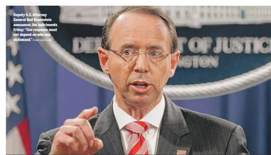  ?? EVAN VUCCI/AP ?? Deputy U.S. Attorney General Rod Rosenstein announces the indictment­s Friday: “Our response must not depend on who was victimized.”