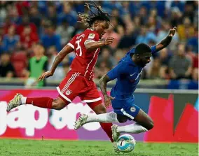  ??  ?? Chelsea’s Jeremie Boga is fouled by Bayern Munich’s Renato Sanches in the Internatio­nal Champions Cup match in Singapore yesterday. Bayern won 3-2. — Reuters No friendly tourney: