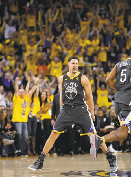  ?? Scott Strazzante / The Chronicle ?? Warriors guard Klay Thompson is rather pumped after hitting a three-pointer in the fourth quarter. He scored 31 points.