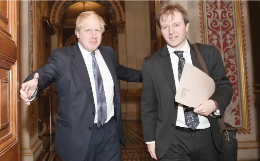  ??  ?? Britain’s Foreign Secretary Boris Johnson with Richard Ratcliffe, the husband of British-Iranian woman Nazanin Zaghari-Ratcliffe who is jailed in Iran, at the Foreign and Commonweal­th Office in London on Wednesday. (AFP)