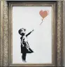  ??  ?? The Banksy canvas that shredded itself after being sold for £1.04m.