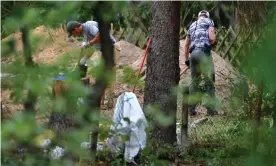  ??  ?? Police officers searching the garden plot in Hanover. Photograph: Alexander Koerner/ Getty Images