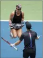  ?? ADAM HUNGER — THE ASSOCIATED PRESS ?? Bethanie Mattek-Sands and Jamie Murray celebrate after winning the mixed doubles final of the U.S. Open tennis tournament, Saturday in New York.