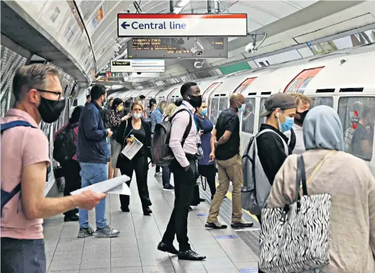  ??  ?? Commuters on the London Undergroun­d yesterday. Tube journeys have increased by just 6 per cent on the previous week