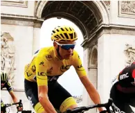  ?? (Reuters) ?? TEAM SKY RIDER Chris Froome of Britain passes the Arc de Triomphe on his ride into Paris on Sunday, when he secured the Tour de France title for the fourth time in his career.