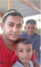  ??  ?? Imu Imran and his two sons outside their home on May 3, 2020.