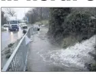  ??  ?? Flooding at the Greystones Roundabout with water gushing from Bray Head and the Golf Course.