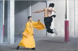  ?? James Dittiger BH Tilt and WWE Studios ?? WONG Jack Man (Yu Xia), left, and Bruce Lee (Philip Ng) in “Dragon.”