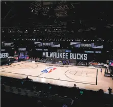  ?? Kevin C. Cox / Getty Images ?? The Milwaukee Bucks’ decision to not take the floor for Game 5 against Orlando prompted the NBA to postpone three games.