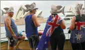  ?? PICTURE: REUTERS/AFRICAN NEWS AGENCY (ANA) ?? Passengers aboard a ferry participat­e in celebratio­ns for Australia Day which for many marks the start of white oppressive colonisati­on and suffering for the Aboriginal people.