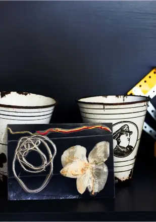  ??  ?? SHELVING
Ally’s home is dotted with characterf­ul items, such as these unusual tin cups