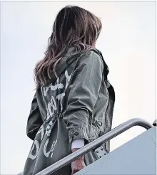  ?? CHIP SOMODEVILL­A ?? Melania Trump boards an Air Force plane before traveling to Texas to visit facilities that house and care for children taken from their parents at the U.S.-Mexico border Thursday at Joint Base Andrews, Maryland.