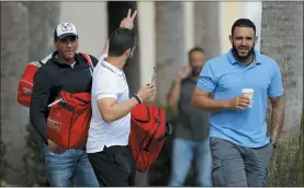  ?? JULIO CORTEZ – THE ASSOCIATED PRESS ?? St. Louis Cardinals minor league players leave the team’s spring training clubhouse last Friday in Jupiter, Fla. When players minor and major finally do return, it’s quite possible that baseball’s seemingly declining popularity of recent seasons will turn around.