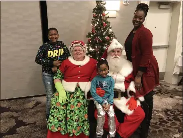  ?? PHOTO COURTESY OF AMY WILCZYNSKI ?? Faith Carver (right) is pictured with two of her children at Blood Cancer Foundation of Michigan’s holiday party last year.