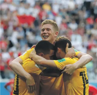  ??  ?? From left, Belgium’s Eden Hazard, Kevin De Bruyne and Dries Mertens celebrate after Hazard scored his side’s second goal during their World Cup third-place play-off match against England in Saint Petersburg