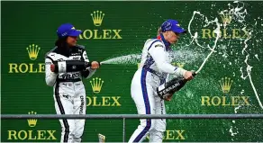  ?? PICTURE: Dan Mullan/getty Images ?? Emma Kimilainen and Jamie Chadwick (left) celebrate on the podium at Spa