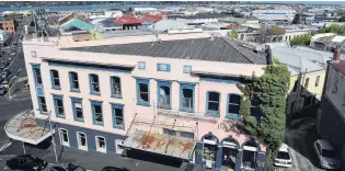  ?? PHOTO: PETER MCINTOSH ?? In need of attention . . . Rundown buildings in Princes St, Dunedin, are for sale. This view is from Stafford St.