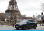  ?? — AFP ?? PARIS: A local resident drives his sport utility vehicle (SUV) in the center of Paris, with the Eiffel Tower seen in the background, on January 30, 2024.