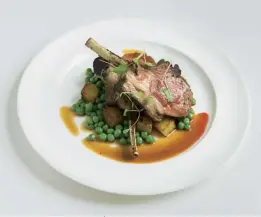  ??  ?? Above Herdwick rack of lamb with confit potatoes and peas. Below Roast pineapple meringue