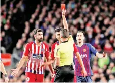  ?? — Reuters photo ?? Atletico Madrid's Diego Costa(L) is shown a red card by referee Jesus Gil Manzano during their La Liga Santander match against FC Barcelona at Camp Nou, Barcelona April 6, 2019.
