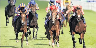  ??  ?? Galileo Chrome and Tom Marquand (right) win the St Leger at Doncaster