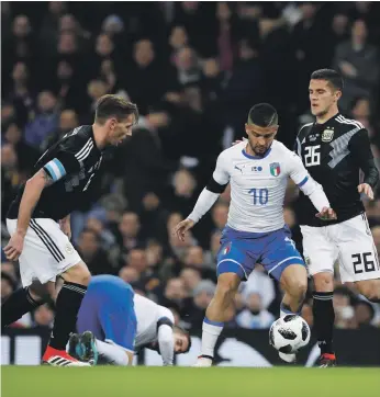  ?? Phil Noble / Reuters ?? Lorenzo Insigne, second from right, is among a group of players that can help Italy play a more progressiv­e brand of football in the future, but that future has not arrived yet