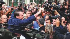  ?? Reuters ?? Far-right lawmaker and presidenti­al candidate Jair Bolsonaro waves after casting his vote in Rio de Janeiro. Polls suggest Bolsonaro can count on more than one in three voters.