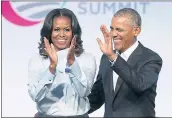  ?? GETTY IMAGES FILE ?? Michelle and Barack Obama have entered into a multiyear agreement to produce films and series with Netflix.