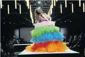  ?? / OUPA BOPAPE / GALLO IMAGES ?? Babalwa Mneno captivates the audience with her multicolou­red dress during the JAHDARA Show at the Joburg Fashion Week at the Sandton Convention Centre.