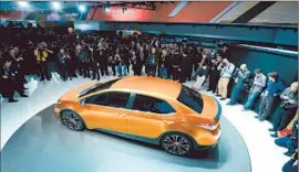  ?? Daniel Acker Bloomberg ?? TOYOTA’S COROLLA FURIA concept vehicle on display in Detroit. Its severely raked windshield and bulging fenders mark a radical departure from the past.