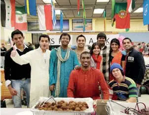  ??  ?? Dinal Perera (Lyceum-wattala) and Devinka Edirrising­he (SBC & CIS) with some of their internatio­nal colleagues at the recently held 30th annual Food Bazaar at the Montana State University at Bozeman. Both engineerin­g majors were placed by Scholarshi­ps...