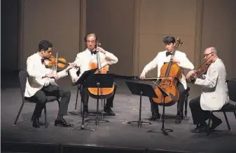  ?? Geoff Sheil ?? Violinist Arnaud Sussmann (left), cellists David Requiro and David Finckel, and violist Paul Neubauer perform Anton Arensky’s String Quartet No. 2 at Music@Menlo.