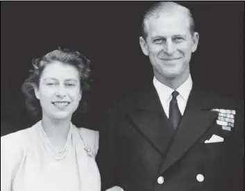  ?? ASSOCIATED PRESS FILES ?? This is the 1947 official photograph of Britain’s Princess Elizabeth and her fiance, Lieut. Philip Mountbatte­n in London. Prince Philip has died at age 99.