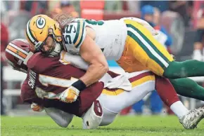  ?? ASSOCIATED PRESS ?? Green Bay linebacker Clay Matthews was not fined for this hit on Washington’s Alex Smith, but he was given a roughing the passer penalty.