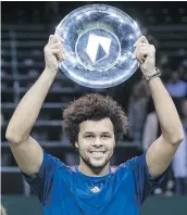  ?? — GETTY IMAGES ?? France’s Jo-Wilfried Tsonga poses with his trophy after winning in Rotterdam on Sunday.