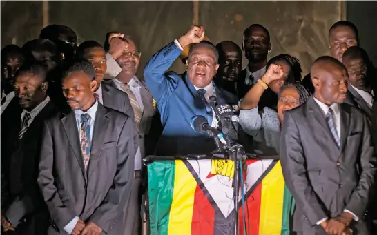  ?? Pictures / AP ?? Emmerson Mnangagwa was in a jubilant mood as he returned to Zimbabwe and Zanu-PF’s party headquarte­rs in Harare this week.