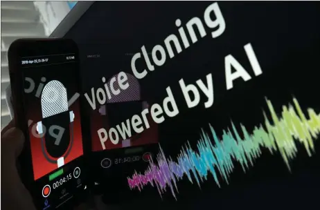  ?? — AFp photo ?? This image depicts a smartphone recording in front of a voice cloning screen in los Angeles, uSA. The biggest peril of AI, experts say, is its ability to blur the boundaries between reality and fiction, handing cybercrimi­nals a cheap and effective technology to exploit.