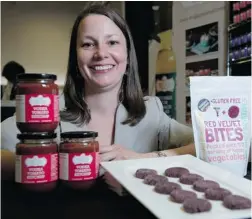  ?? RICHARD LAM/ PNG ?? Catherine Anderson, owner of Trugs Gourmet Foods, unveils her Vodka Ketchup and Red Velvet Cookies at the Vancouver Convention Centre.