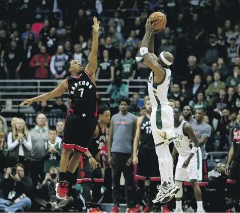  ?? DYLAN BUELL/GETTY IMAGES ?? Toronto Raptors guard Kyle Lowry, seen defending Milwaukee Bucks guard Jason Terry during the first round of the NBA playoffs last month in Milwaukee, has little to say about his team’s inflated assist ratio in the post-season. “We made a lot of...