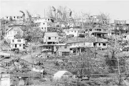  ?? RICARDO RAMIREZ BUXEDA/STAFF PHOTOGRAPH­ER ?? The town of Canovanas reflects the destructio­n left behind by Hurricane Maria. Eight weeks after the hurricane hit, more than half of Puerto Ricans remain without power.