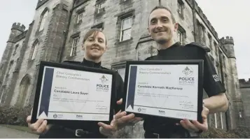  ??  ?? 0 Constables Laura Sayer and Kenneth Mackenzie with their Police Scotland bravery awards