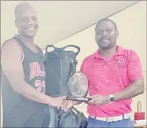  ?? (Courtesy pics) ?? November Previc Golf Challange edition champion Cosmo Mthethwa (L) smiles after being announced the winner to take home a brand new golf bag plus trophy from Mananga Golf Club Captain Wandile Simelane on Saturday afternoon.