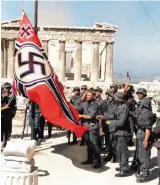  ??  ?? Raising the swastika in front of the Parthenon, Athens on 30 March 1941
