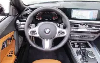  ??  ?? The Z4’s cockpit is tidy, rich in finish and feel, and well appointed.